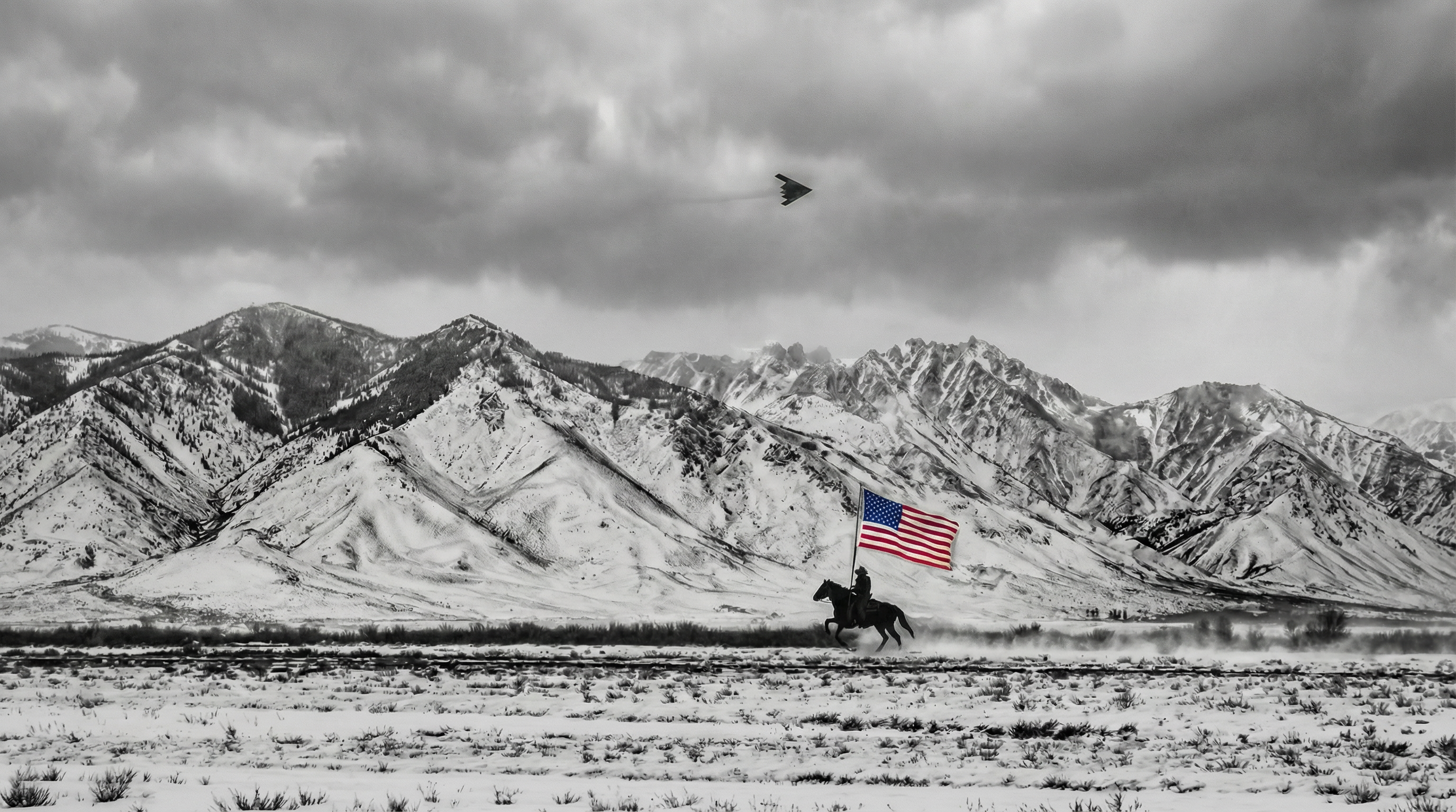 Horseback rider with American flag against snowy mountains